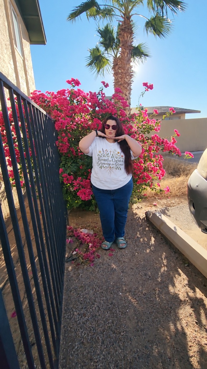Destinie wearing the white Rooted in Christ & Growing in Grace T-shirt